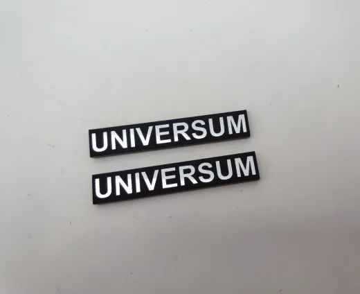 Universum 50x9mm siyah üstü gümüş renk yazılı logo